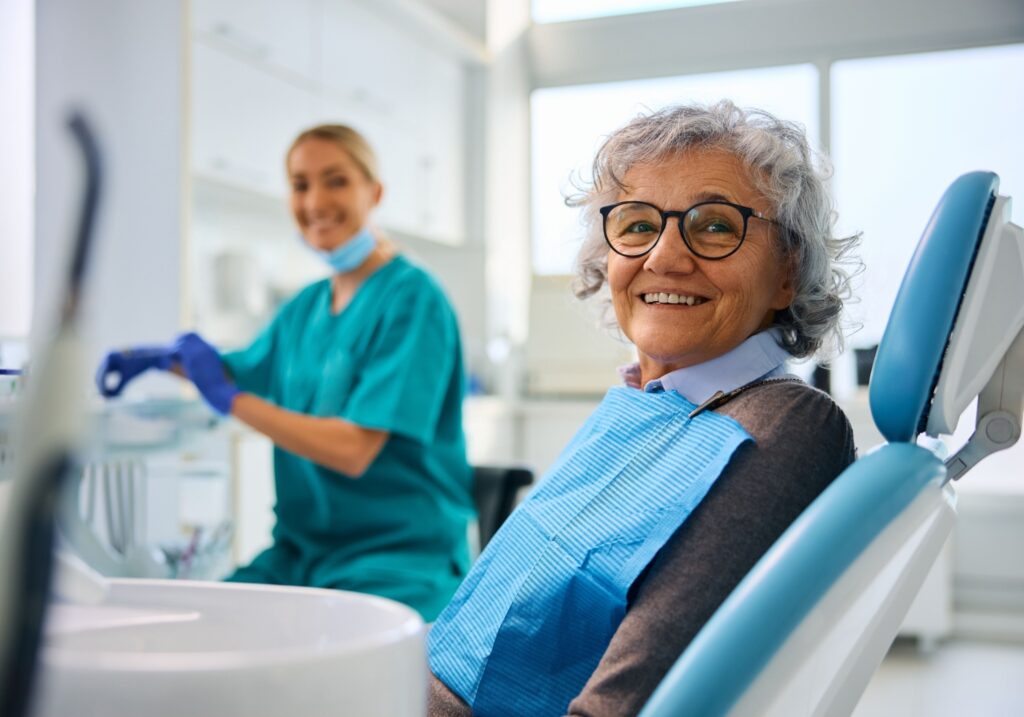 A patient sitting in the chair at their dentist office before an exam.
